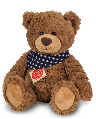 Brown teddy bear with star print scarf by Teddy Hermann