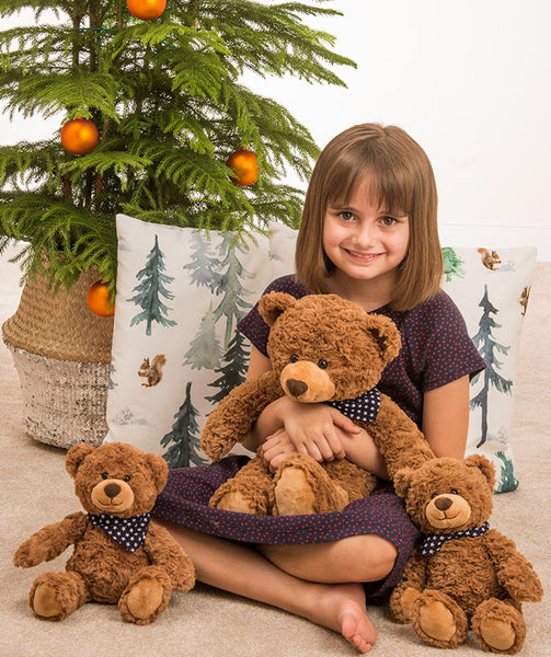 Brown teddy bear with star print scarf by Teddy Hermann